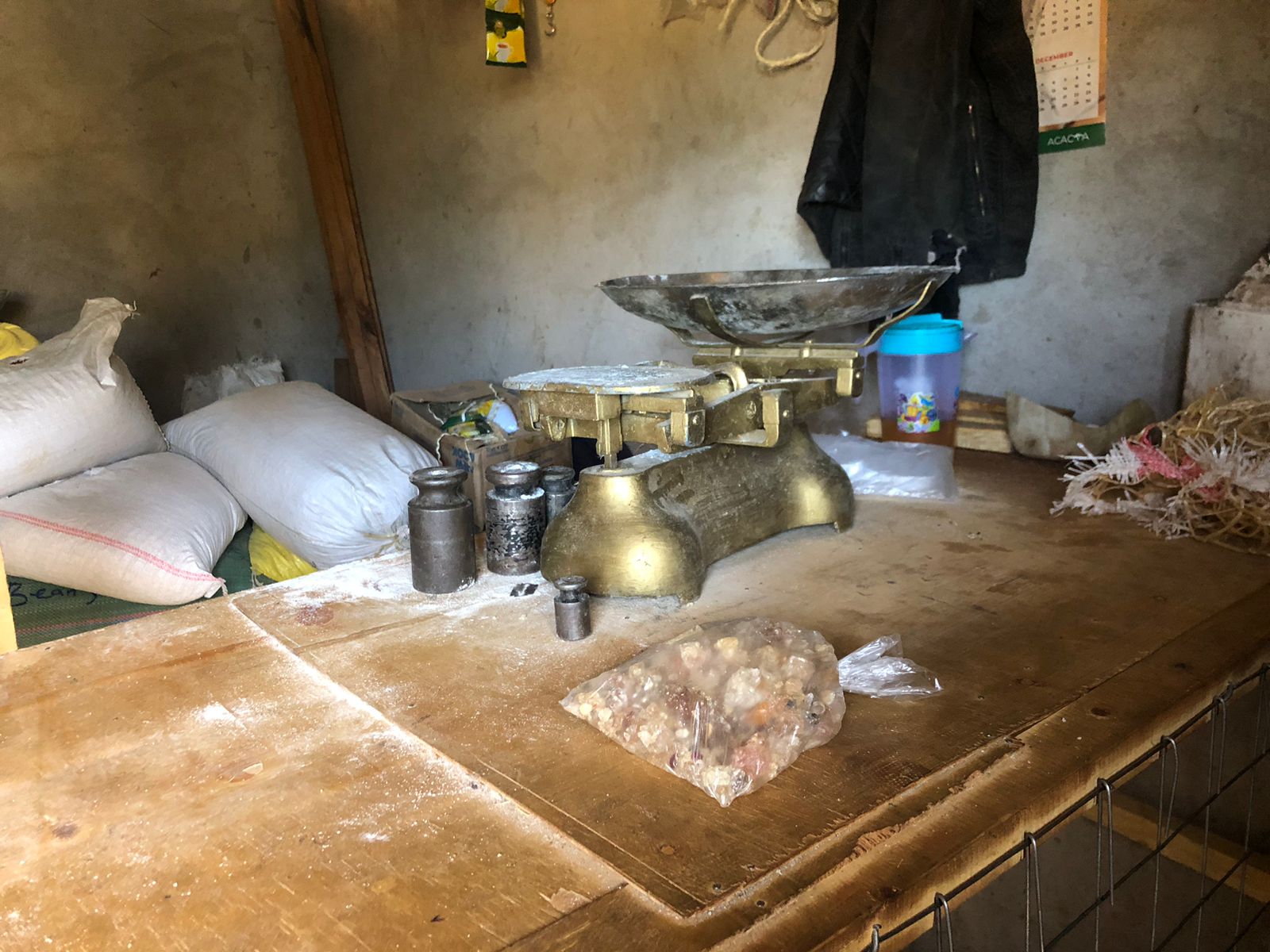 Dukawala community shop with weighing scale and food supplies